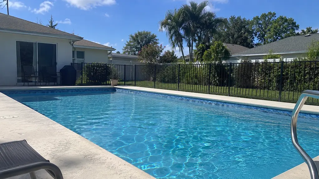 A clean vinyl-liner backyard pool