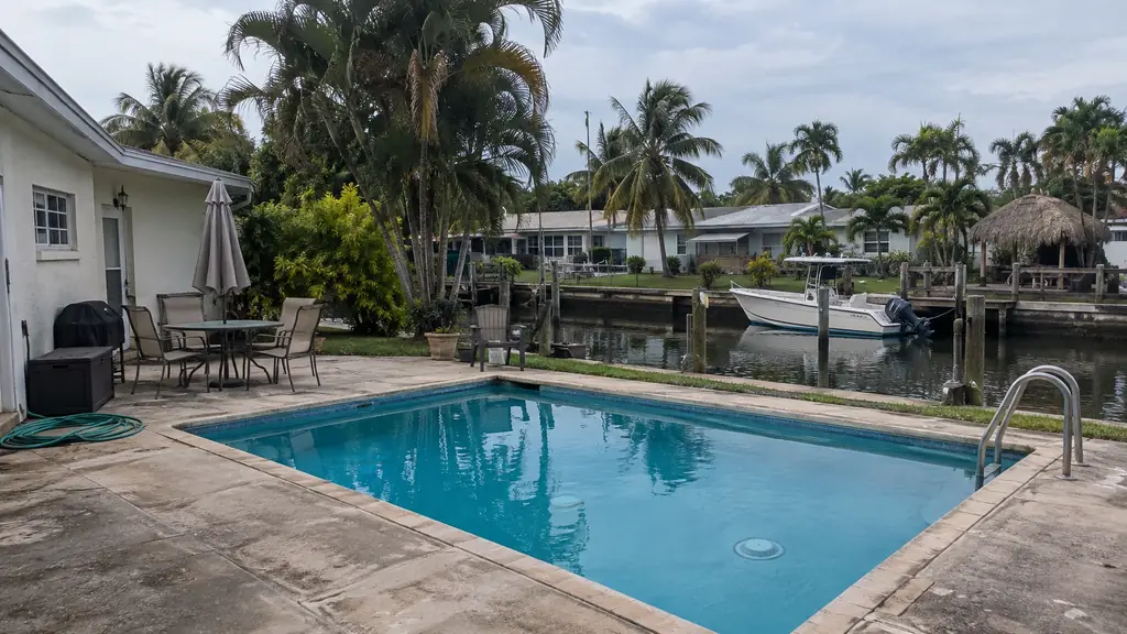 A backyard swimming pool at a home in Dania Beach, FL