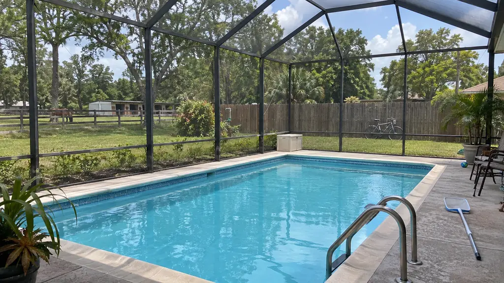 A backyard swimming pool at a home in Plantation, FL