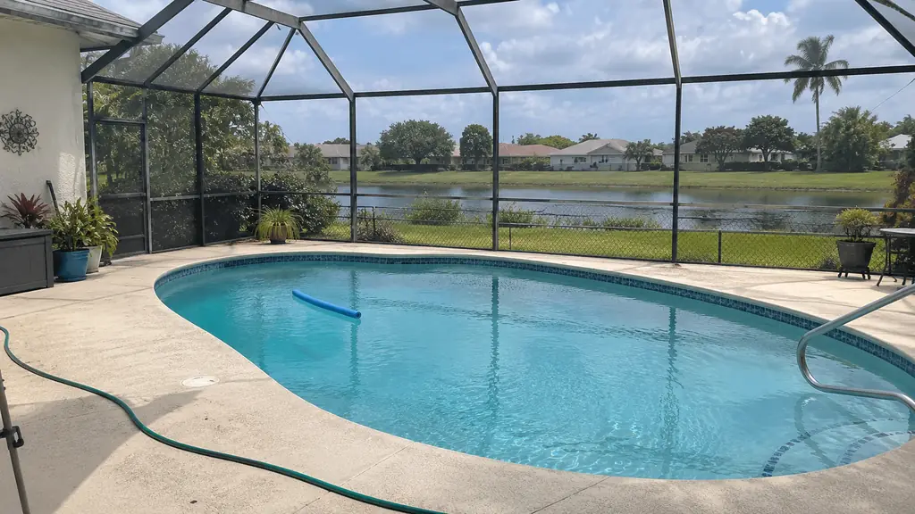 A backyard swimming pool at a home in Sunrise, FL