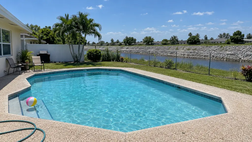 A backyard swimming pool at a home in Tamarac, FL