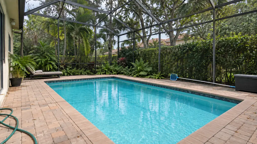 A backyard swimming pool at a home in Weston, FL